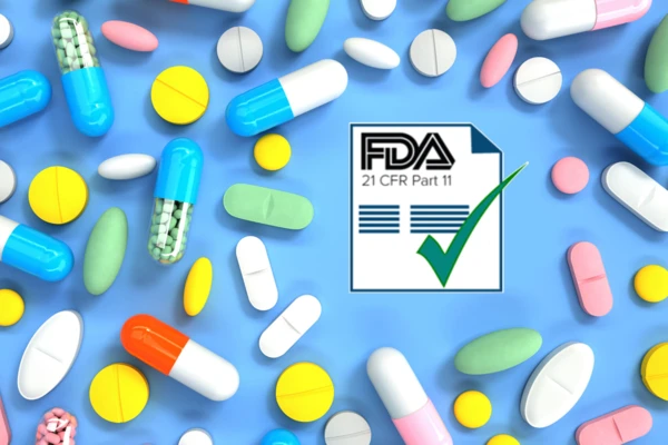 Colorful assortment of pharmaceutical pills and capsules overlaying a blue background, featuring the FDA 21 CFR Part 11 compliance logo.